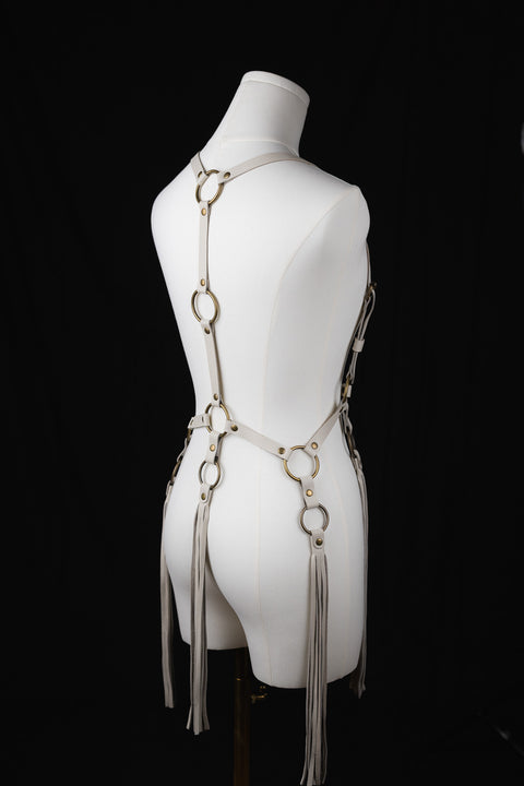 handmade leather harness featuring brass o-ring fringe tassel design