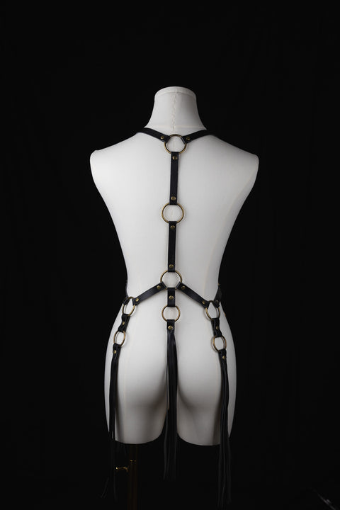 adjustable artisan leather harness with long fringe for dynamic styling

