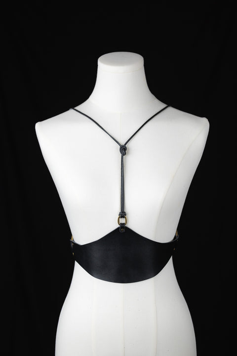 Black leather corset for layering over dresses or tops