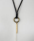 Close up of the Bijou by Juju black leather collar bottom brass loop
