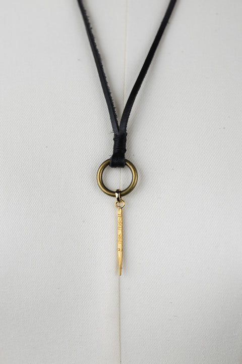 Close up of the Bijou by Juju black leather collar bottom brass loop