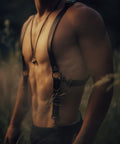 Man wearing Bijou by Juju black leather suspenders with brass hardware — handmade in Ecuador, festival-inspired, adjustable, and built for versatile styling.