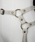 close up of off white bijou by juju fringe belt with brass loops