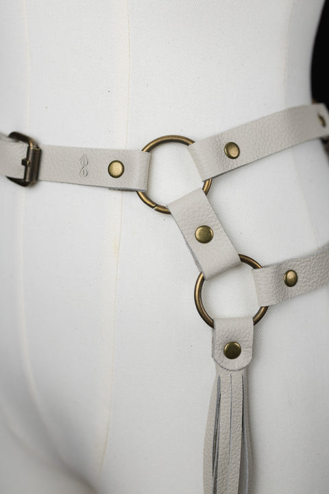 close up of off white bijou by juju fringe belt with brass loops