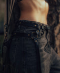 close up of Ethically sourced leather fringe belt with swaying tassels