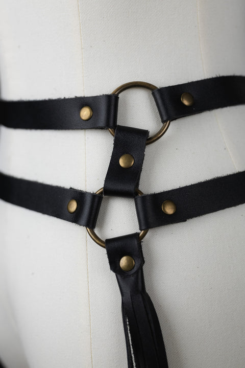 close up of brass loops on Leather fringe belt that moves with your body for performance