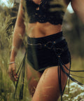 woman in handmade leather fringe belt with brass O-rings for movement