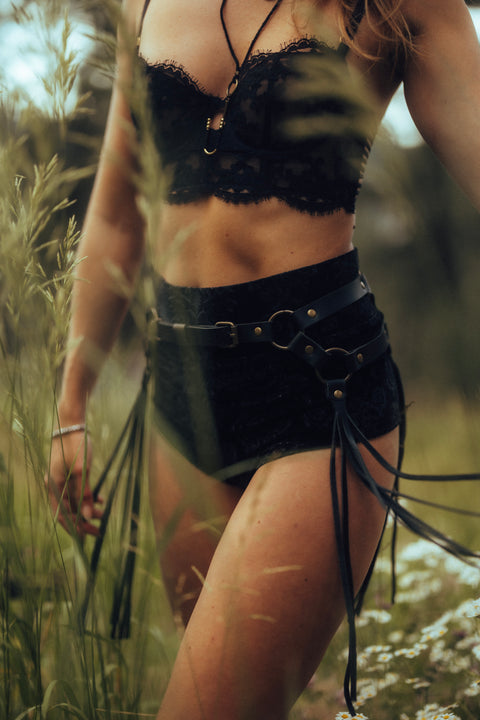 woman in handmade leather fringe belt with brass O-rings for movement