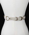 off white corset close up of brass buckle 