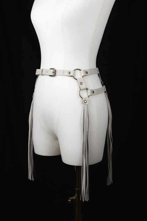 Statement-making off white leather fringe belt for evening looks