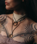 Leather choker necklace with brass O-ring accents