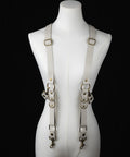 Handmade off-white leather suspenders for men or women, brass clip hardware, product photo on mannequin.